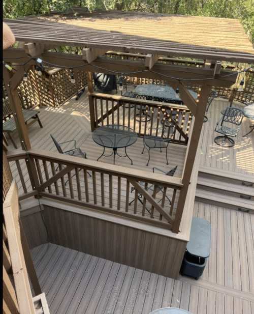 Superior backyard transformation with heat resistant composite decking, and a pergola installed by Sasquatch Deck